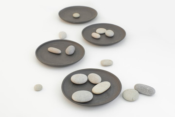 Small ceramic Japanese plates, Oriental ware on a white background