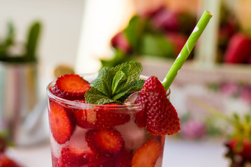 Homemade strawberry lemonade with mint on a white background