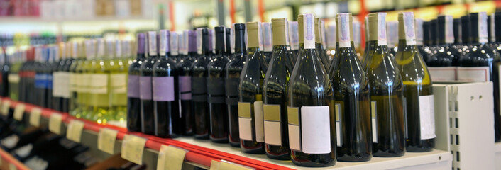 Red and white wine in bottles