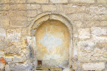 Fototapeta na wymiar cracked concrete vintage stone wall background texture. Part of the stone wall 