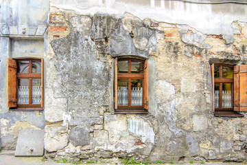 retro wooden window on a cracked concrete vintage brick wall background 