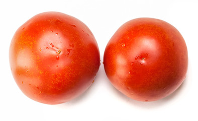 two red tomatoes on a white background
