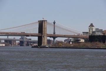 Fototapeta na wymiar View at Brooklyn Bridge from water