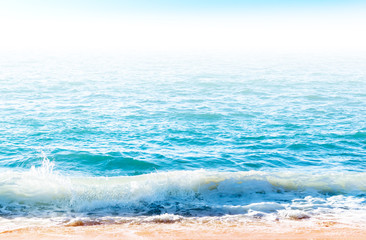 Obraz na płótnie Canvas Ocean surface with waves near the beach