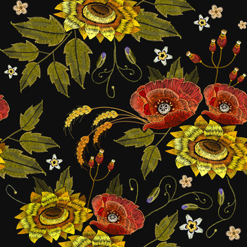 Embroidery rose and sunflowers seamless pattern. Beautiful embroidery blossoming sunflowers and red roses, fashion template for clothes, t-shirt design