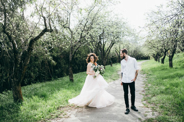  Loves and very happy groom and bride in the park