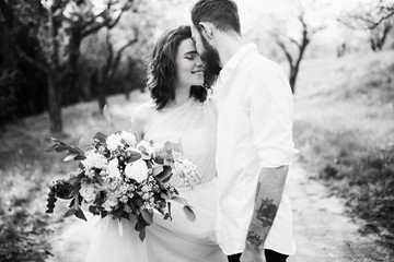  Loves and very happy groom and bride in the park