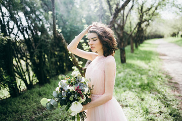 Portrait of beautiful bride in the park