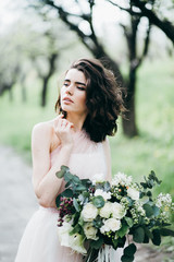 Portrait of beautiful bride in the park