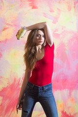 Fototapeta premium Pretty girl or beautiful painter with spray paint bottle