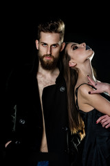 couple of bearded man, woman in black with fashionable makeup