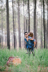 An Asian young adult couple traveling in pine forest, Thailand