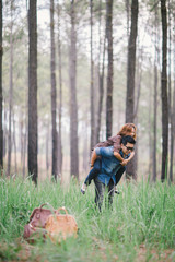 An Asian young adult couple traveling in pine forest, Thailand