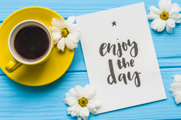 Still life with cup of tea and cake on the wooden background