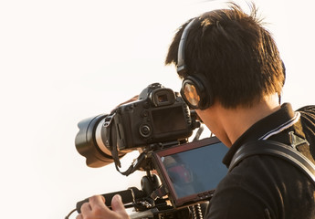 Video camera man operator working with professional equipment,filming recording