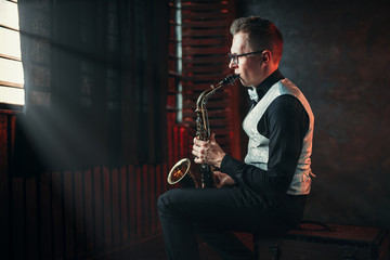 Saxophonist playing jazz melody on saxophone