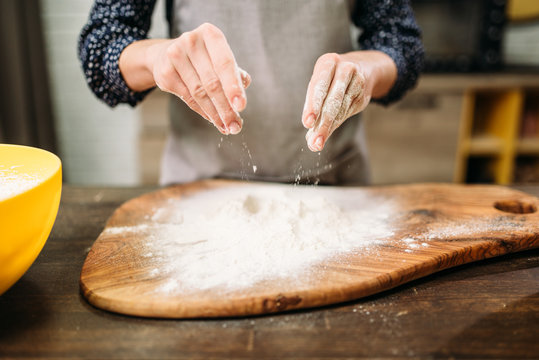 Female person hands in the flour, cake cooking