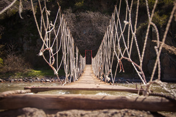 Rope bridge in the mountains - 146745222