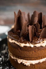 Chocolate cake on the rustic background. Selective focus.