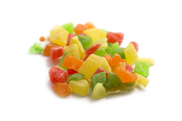 bunch of colorful candied fruits isolated on white background. dry fruits