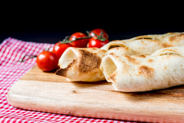 Mexican fajita wraps with grilled chicken fillet and fresh vegetables