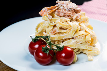 tasty pasta with salmon on a the table