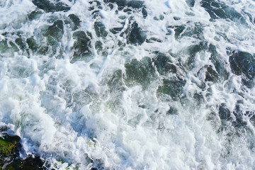 Fototapeta na wymiar strong sea wave splashing on the sandy beach shore