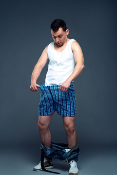Man with pants down, prostate problem concept