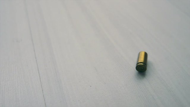 Bullet drops to the floor. HD slowmo footage.