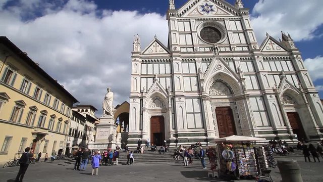 Tourists visiting Piazza Santa Croce and the Monument to Italian poet Dante Alighieri in Florence, Italy