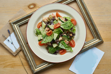 Mixed salad with chicken breast, bacon and fresh vegetables dressed yoghurt mustard sauce