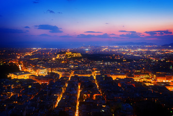 Obraz premium panoramic cityscape of Athens with Acorpolis hill and sea at night, Greecer, retro toned