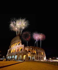 Colosseum illuminated with fireworks in Rome.