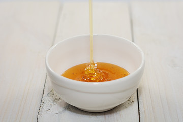 Bowl is filled with flower honey