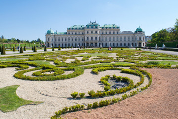 Unidentified people walk through the gardens of Belvedere Palace, Vienna, Austria