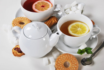 Delicious light breakfast in white ceramics with light tea with cookies