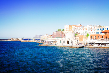 embankment and venetian bay with Turkish Mosque Yiali Tzami of Chania, Crete, Greecer, retro toned