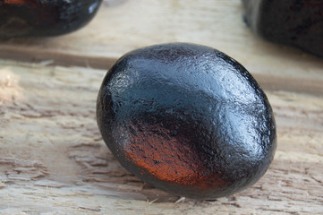 Black Stone on Wood