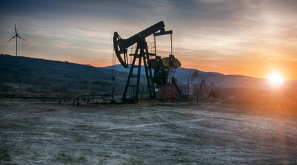 Naklejka premium oil pump on sunset