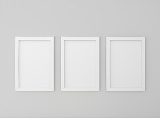 Interior empty room with three empty white picture frames on dark wall. Mock-up template for display, products, title or logo. Studio or blank office space. 3d illustration