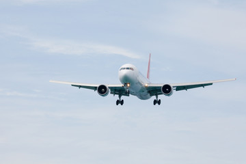 Fototapeta na wymiar Passenger airplane approaching an airport