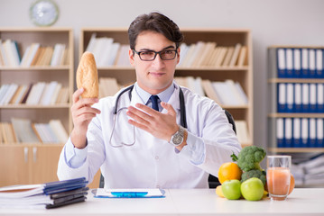 Doctor in dieting concept with fruits and vegetables