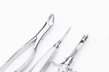 Dental tools and equipment on white background
