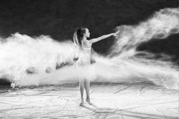 Black and white portrait of young dancer with white flour flipping from her hair
