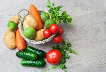A crop of fresh vegetables on a wooden table. The concept of farming.