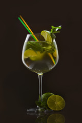 Cocktail of tropical and exotic fruits. On a black background. Top view.