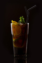 Cocktail of tropical and exotic fruits. On a black background. Top view.