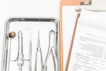 Dental tools, equipment and dental chart on white background