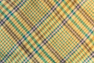 Texture, background of a tartan yellow fabric