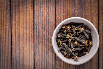 allspice. On Wooden background. Top view.